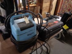 A Challenge hydraulic floor jack together with a Kew pressure washer