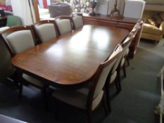 A Willis and Gambier extending dining room table on double pedestal with leaf,