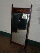 An inlaid mahogany bevelled mirror