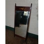 An inlaid mahogany bevelled mirror