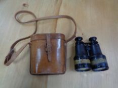 A pair of WW I binoculars in brown leather case