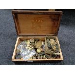 A pine box containing brass and other furniture parts, door escutcheons, handles,