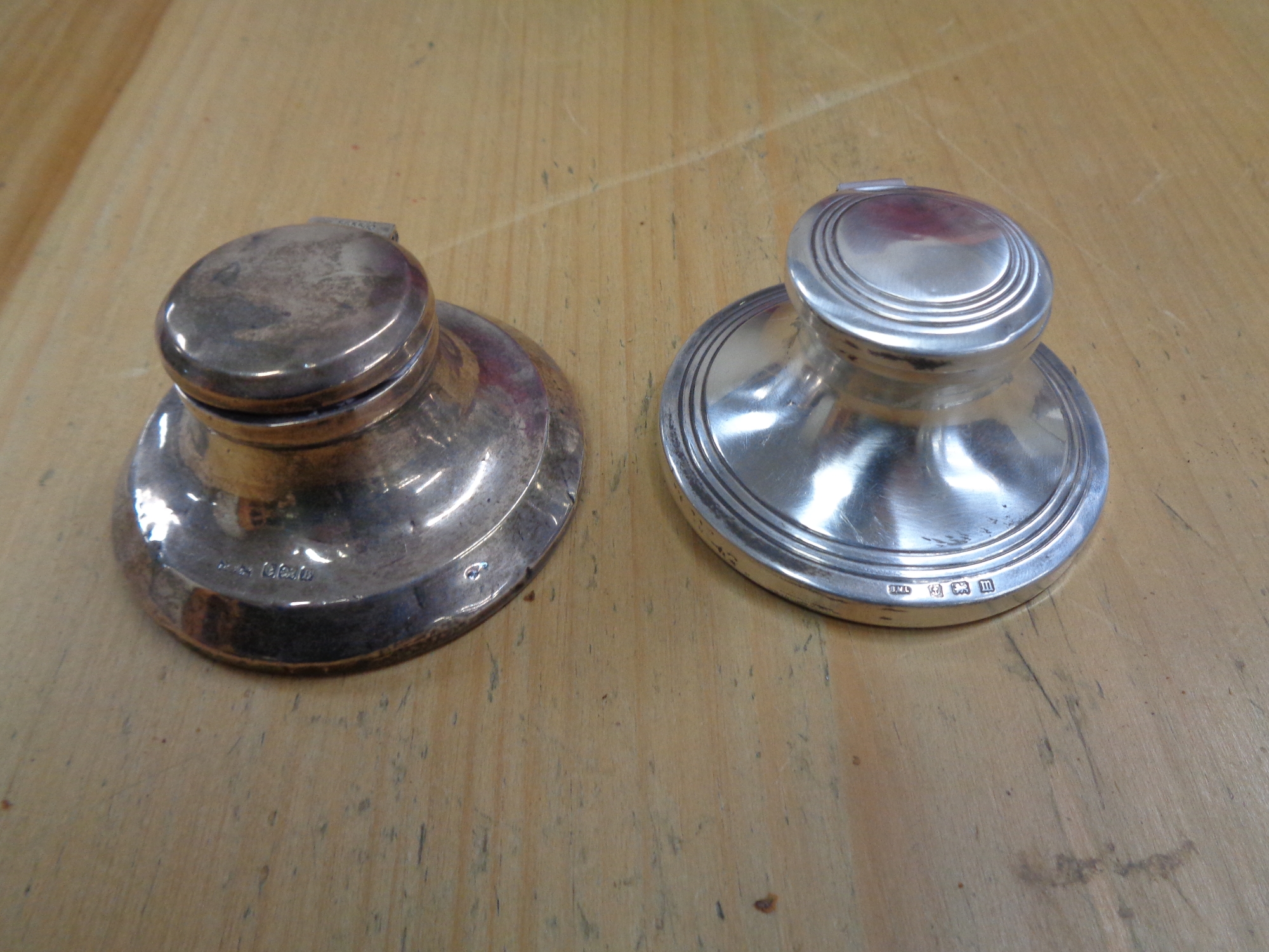 Two silver capstan inkwells (2)