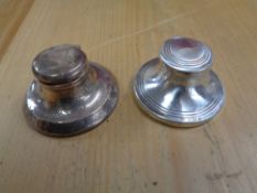 Two silver capstan inkwells (2)