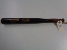 A nineteenth century hand painted wooden truncheon, length 43 cm.