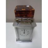 An early twentieth century chrome carriage clock in leather case CONDITION REPORT: