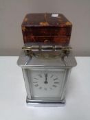 An early twentieth century chrome carriage clock in leather case CONDITION REPORT: