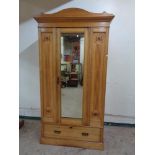 A late Victorian pitch pine mirrored wardrobe with matching dressing chest