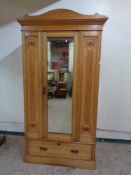 A late Victorian pitch pine mirrored wardrobe with matching dressing chest