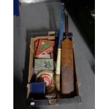 A box of vintage games, old Slazenger cricket bat, hockey stick,
