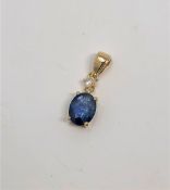 A 14ct gold sapphire and diamond pendant, the sapphire 1.45 carat, the diamond 0.07 carat.