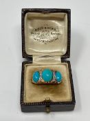 A Victorian yellow gold diamond set three stone turquoise ring, size Q.