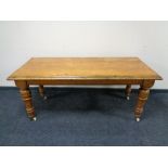 A Victorian oak table on ceramic casters