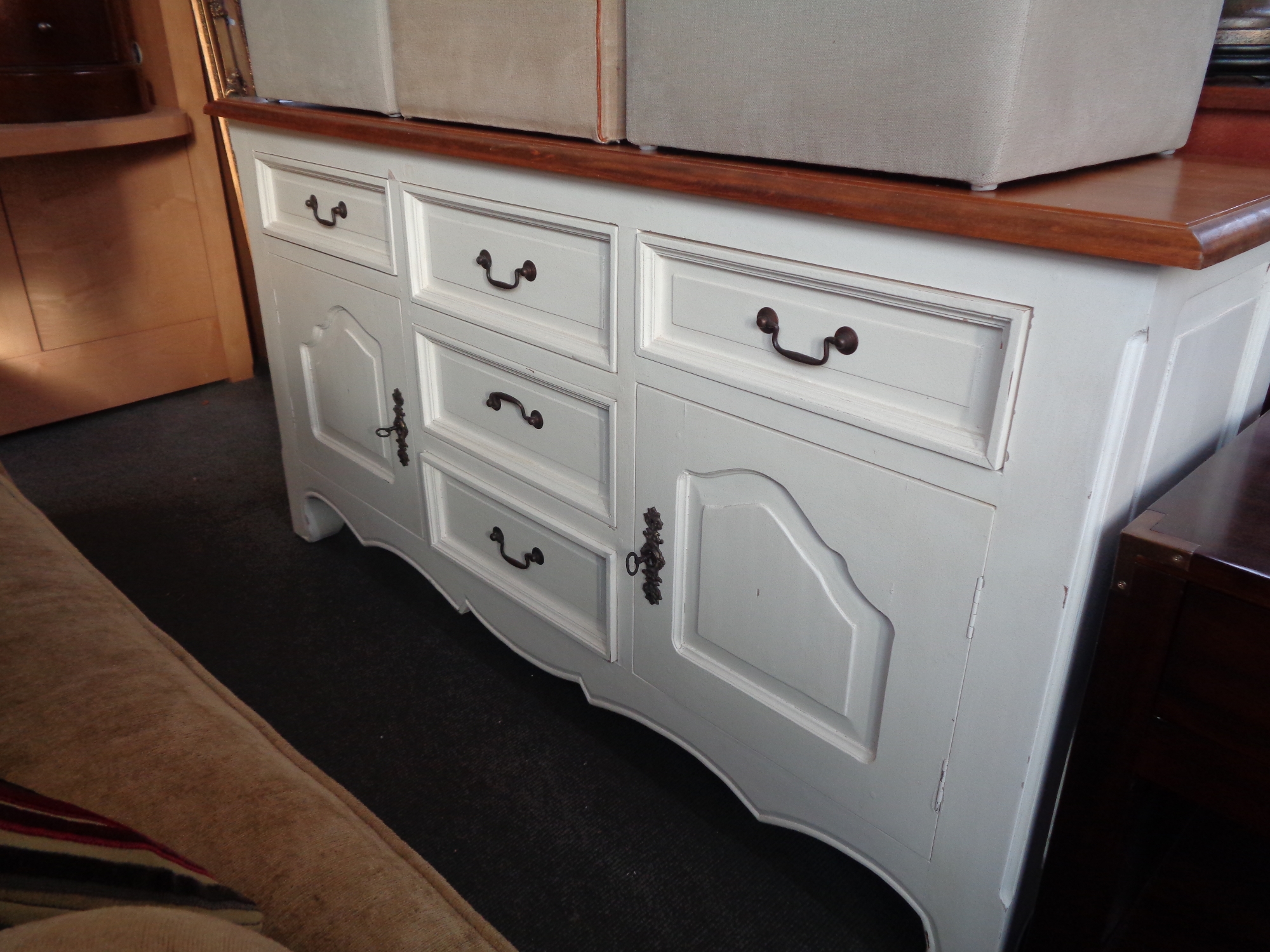 An antique style farmhouse dresser with painted base