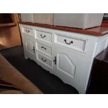 An antique style farmhouse dresser with painted base