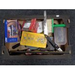 A crate of drill bits, hand saw,