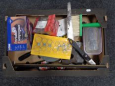 A crate of drill bits, hand saw,