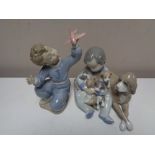 A Lladro figure - Child holding dogs together with a Nao figure of a child with aeroplane (2)