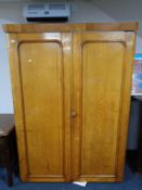 A Victorian oak double door wardrobe