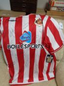 A signed Sunderland football shirt (with retail tags)