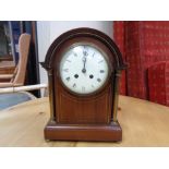 An Edwardian inlaid mahogany bracket clock with brass pillar supports