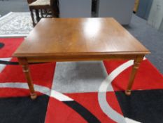 A square oak coffee table