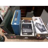 A box of Sinclair ZX-81 console, Black and Decker wall stripper, Imperial Typewriter,