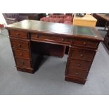 A good quality mahogany Victorian style pedestal desk with tooled leather top CONDITION