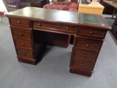 A good quality mahogany Victorian style pedestal desk with tooled leather top CONDITION