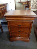 A pair of Willis and Gambier three drawer bedside chests, height 66 cm, width 50 cm, depth 42 cm.