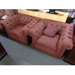 A pair of Chesterfield style club chairs upholstered in two-tone red fabric (2)