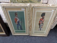 A pair of cream and gilt framed M Greensmith colour prints depicting a private of the 17th regiment