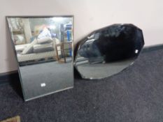 An Edwardian frameless mirror together with a further frameless mirror