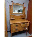 A late Victorian walnut mirror door wardrobe with matching dressing table
