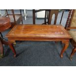 A carved hardwood inlaid brass occasional table