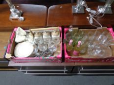 Two crates of wine glasses, gilded dinner ware, storage containers,