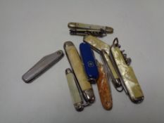 Ten small pocket / pen knives