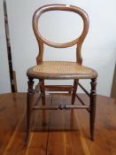 An antique bergere bedroom chair