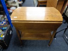 An early twentieth century oak flap sided trolley