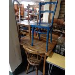 An Ibex chair together with two further kitchen chairs and wooden table