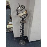 A cast iron armillary sphere on stand