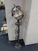 A cast iron armillary sphere on stand