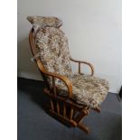 An oak framed rocking/slider chair