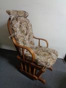 An oak framed rocking/slider chair