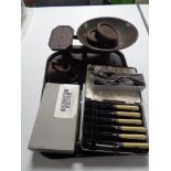 A tray of cutlery, cast iron weights,