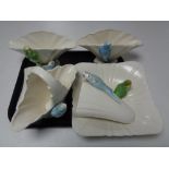 A tray of ceramic budgerigar,