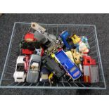 A wire basket containing mid century and later die cast vehicles, Corgi,