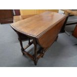 An early twentieth century oak gate-legged leg dining table.