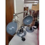 A pair of industrial style metal lamps