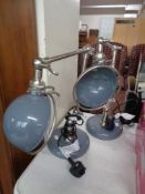 A pair of industrial style metal lamps